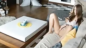 Sofa masturbation session in a hidden cam video with petting and real orgasms