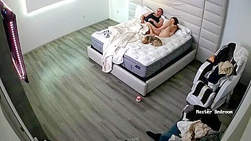 Hidden camera in the bedroom exposes a kinky couple making out on a bed
