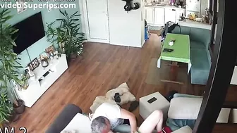 Spy recording of a step-daughter banging her step-dad in the living room