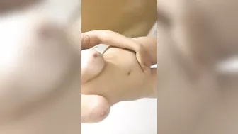 Brunette Babe Fingers Herself in Public Bathroom Selfie