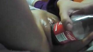 Shaven Teen Pussy Masturbates with Dildo and Coca Cola Bottle!