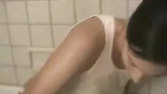 Masturbating Brunette Teases with Big Tits and Wet Panties in Bathtub Striptease