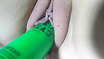 Nicki Shaved Pussy Gets Slippery with a Shampoo Bottle