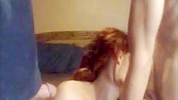 Redhead MILF Swinger Gives Blowjob in Amateur Threesome