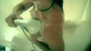 Mom secretly filmed in the bathroom during shower masturbation using a shower nozzle