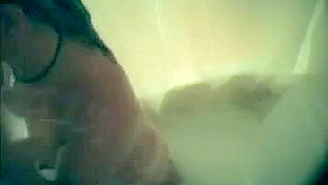 Mom secretly filmed in the bathroom during shower masturbation using a shower nozzle