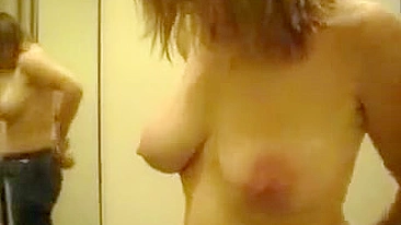 Horny son secretly filming a busty mother while she is changing clothes