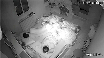 Mother and son in the same bed, a hidden camera caught her masturbating while he sleeps