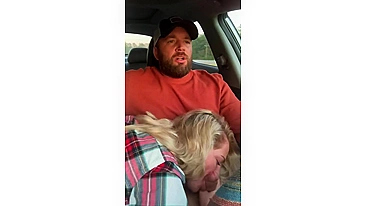 Husband receives a blowjob in car from wife while driving