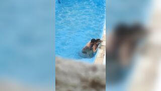 Horny couple makes sex in public swimming pool while hidden voyeur records