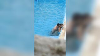 Horny couple makes sex in public swimming pool while hidden voyeur records