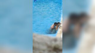 Horny couple makes sex in public swimming pool while hidden voyeur records