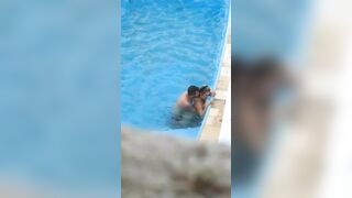 Horny couple makes sex in public swimming pool while hidden voyeur records