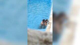 Horny couple makes sex in public swimming pool while hidden voyeur records