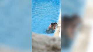 Horny couple makes sex in public swimming pool while hidden voyeur records