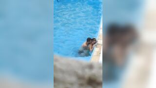 Horny couple makes sex in public swimming pool while hidden voyeur records