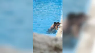 Horny couple makes sex in public swimming pool while hidden voyeur records