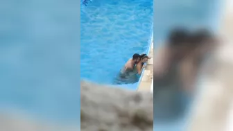 Horny couple makes sex in public swimming pool while hidden voyeur records