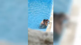 Horny couple makes sex in public swimming pool while hidden voyeur records