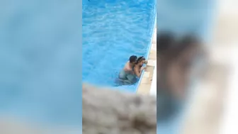 Horny couple makes sex in public swimming pool while hidden voyeur records