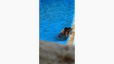 Horny couple makes sex in public swimming pool while hidden voyeur records