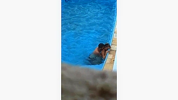 Horny couple makes sex in public swimming pool while hidden voyeur records