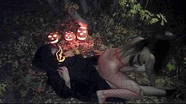 Amateur couple makes sex in the woods on the Halloween