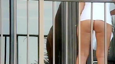 Hot naked woman on hotel balcony caught voyeur