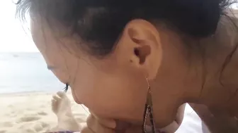 Passionate Asian Babe Blowing Her Stud At The Beach