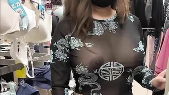 Superb wife with big tits wearing see through blouse in store revealing her nipples