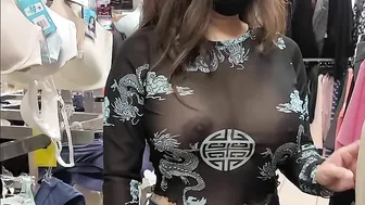 Superb wife with big tits wearing see through blouse in store revealing her nipples