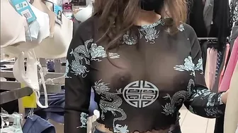 Superb wife with big tits wearing see through blouse in store revealing her nipples