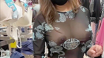 Superb wife with big tits wearing see through blouse in store revealing her nipples
