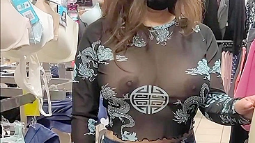 Superb wife with big tits wearing see through blouse in store revealing her nipples