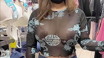 Superb wife with big tits wearing see through blouse in store revealing her nipples