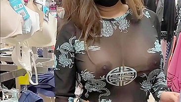 Superb wife with big tits wearing see through blouse in store revealing her nipples
