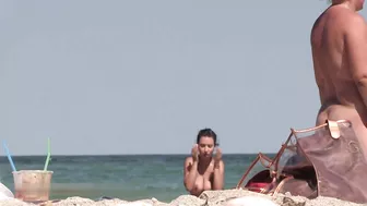 Nude woman with fantastic natural boobs filmed voyeur at beach