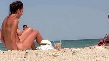Nude woman with fantastic natural boobs filmed voyeur at beach