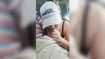 Husband gets a blowjob from wife while driving the car