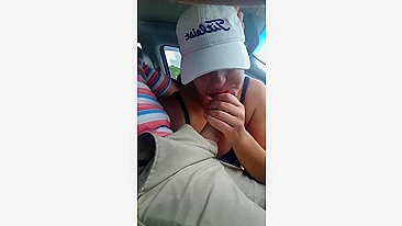 Husband gets a blowjob from wife while driving the car