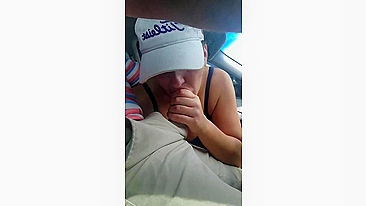 Husband gets a blowjob from wife while driving the car