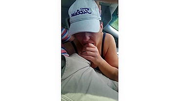 Husband gets a blowjob from wife while driving the car