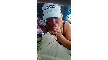 Husband gets a blowjob from wife while driving the car