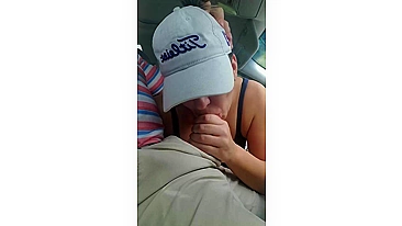 Husband gets a blowjob from wife while driving the car