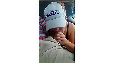 Husband gets a blowjob from wife while driving the car