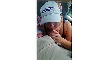 Husband gets a blowjob from wife while driving the car