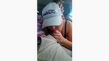 Husband gets a blowjob from wife while driving the car