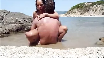Passionate Couple Engages In Sensual Lovemaking On A Secluded Beach