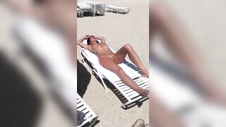 Sultry Woman With Flawless Physique, Shaved Pussy Basks In Beach Sun