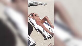 Sultry Woman With Flawless Physique, Shaved Pussy Basks In Beach Sun